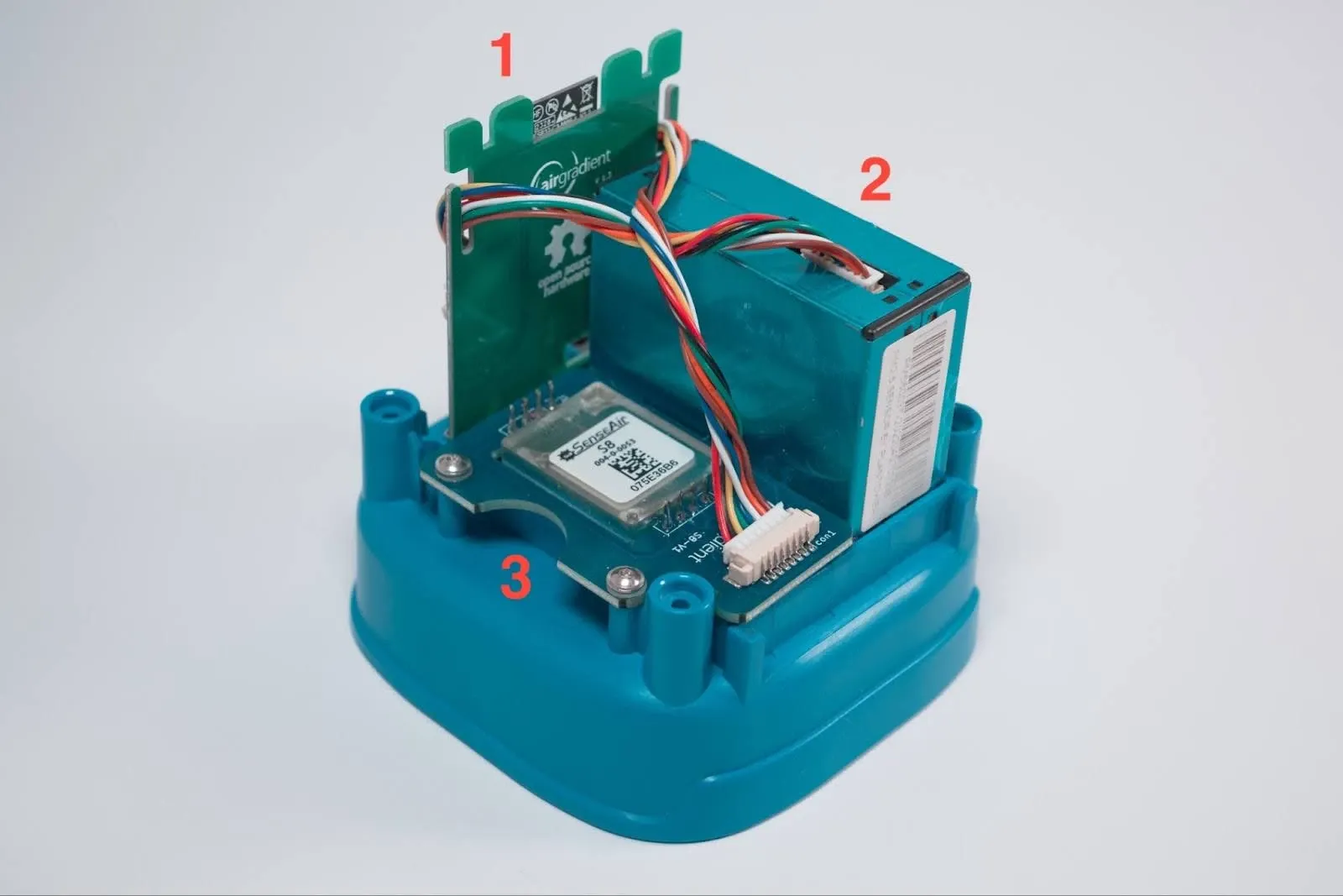 Components of the Open Air Monitor are numbered in the text above.